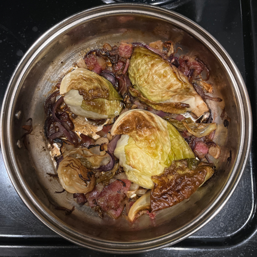 cooked cabbage in a stainless steel pan